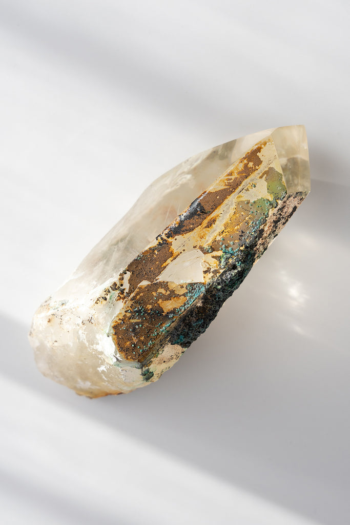 polished Quartz point with Chrysocolla