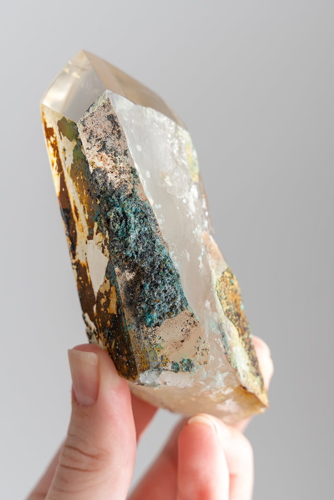 polished Quartz point with Chrysocolla