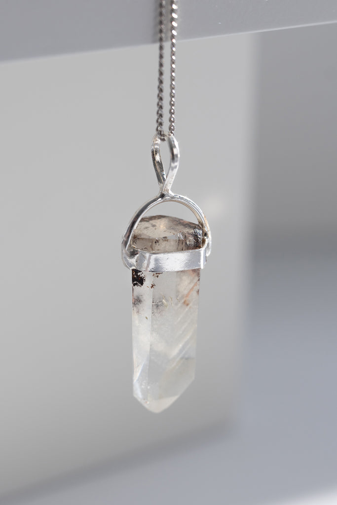 Crystal pendant necklace on a white background