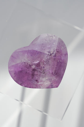 Purple crystal on a white background