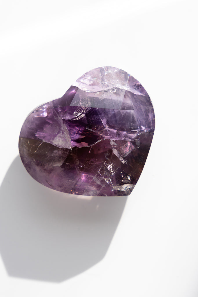 Amethyst crystal on a white background