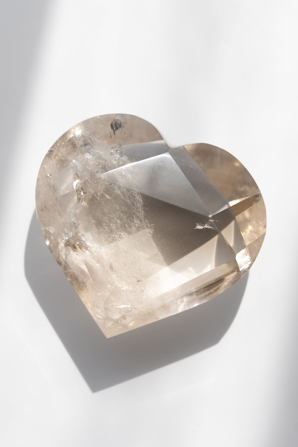Heart-shaped crystal on a white background