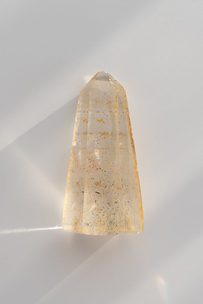 Included quartz obelisk raw back