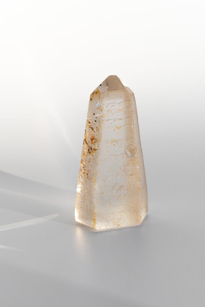 Included quartz obelisk raw back