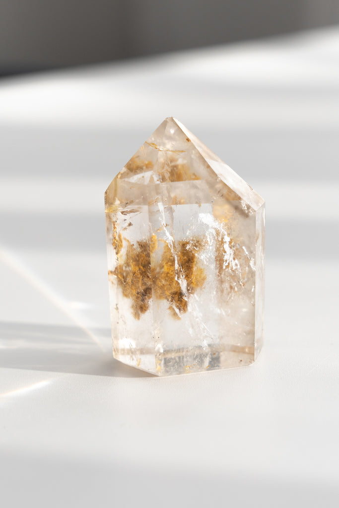 Included smokey quartz point