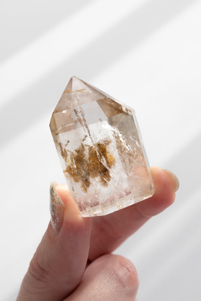 Included smokey quartz point